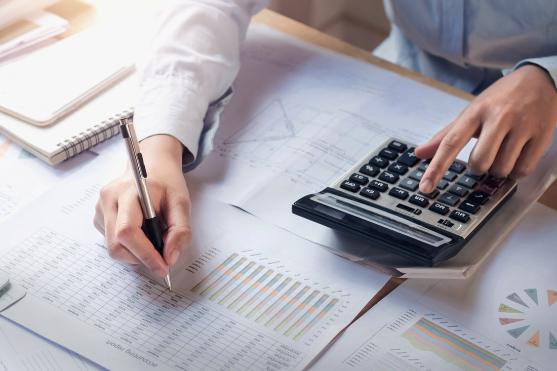 finance-and-accounting-concept-business-woman-working-on-desk-using-calculator-to-calculate-141544975_orig